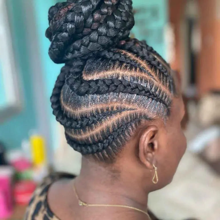 12 Twistiest Swirl Cornrows to Wow the Crowd 12 Braided Bun With Swirling Cornrows
