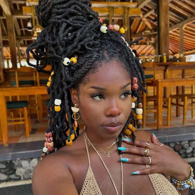 10 Stunning Hairstyles for Black Women 2 Beads With Messy Dreadlock Bun on Long Black Hair