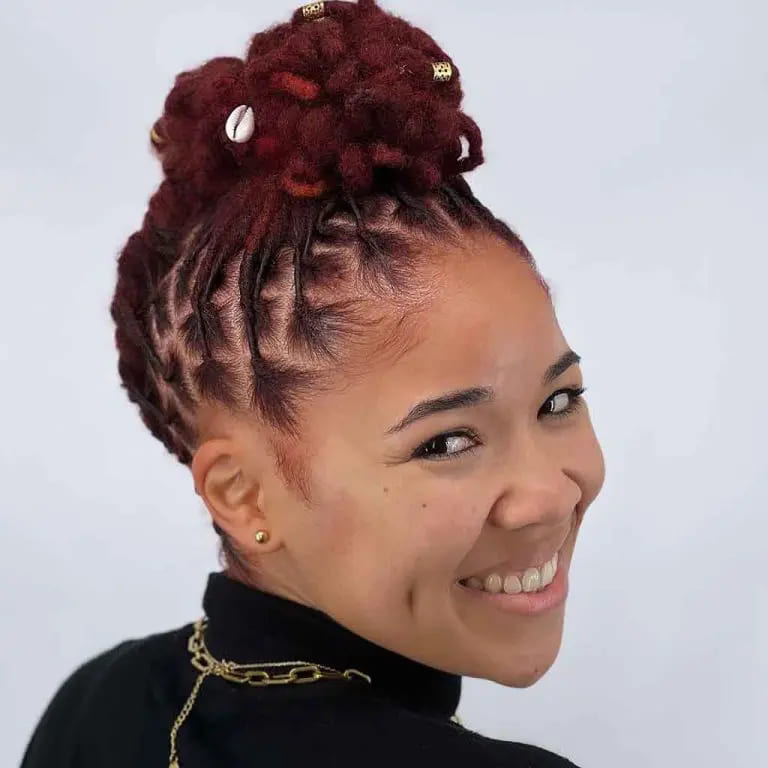 10 Stunning Hairstyles for Black Women 9 Boxed Red Dreadlocks Tied Up in a Top Bun