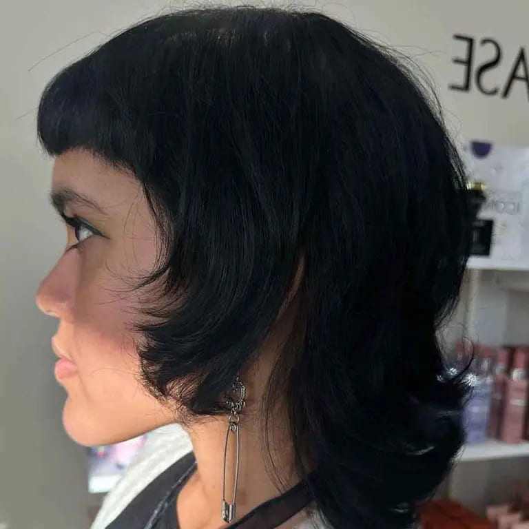 10 Black Wolf Cut Ideas for Women Ultimate Elegance 4 Coal Black Short Shag Mullet Wolf Cut With Micro Bangs