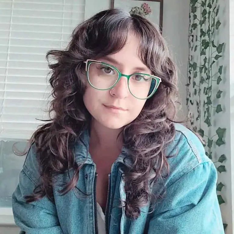 10 Long Wolf Cuts With Curtain Bangs to Wow the Crowd 6 Curly Deep Coffee Brown Wolf Cut With Wavy Micro Curtain Bangs