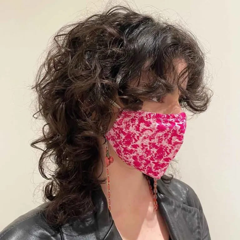 10 Edgy and Stylish Soft Mullet Hairstyles 5 Curly Soft Mullet With Curly Bangs