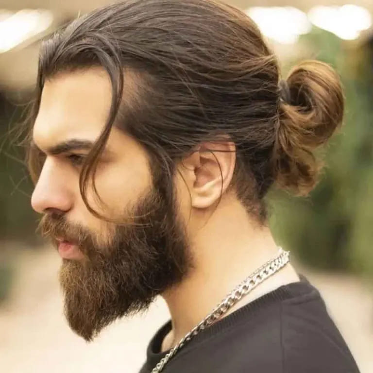 12 Dapper Hairstyles for Long-Haired Men 3 Dark Brown Messy Man Bun