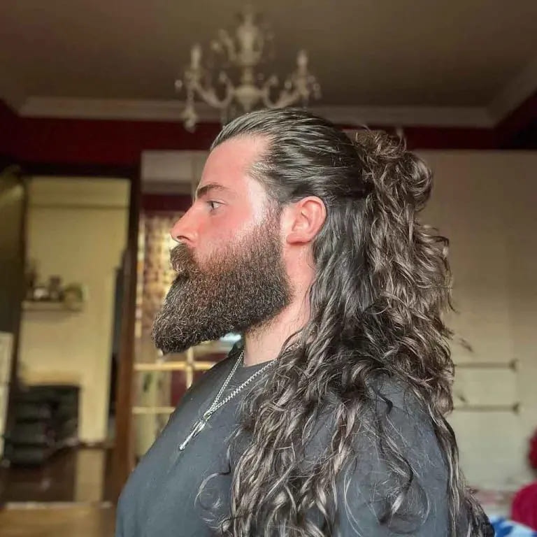 12 Dapper Hairstyles for Long-Haired Men 5 Effortless Half Bun With Wavy Ends and Half Bun on Long Hair