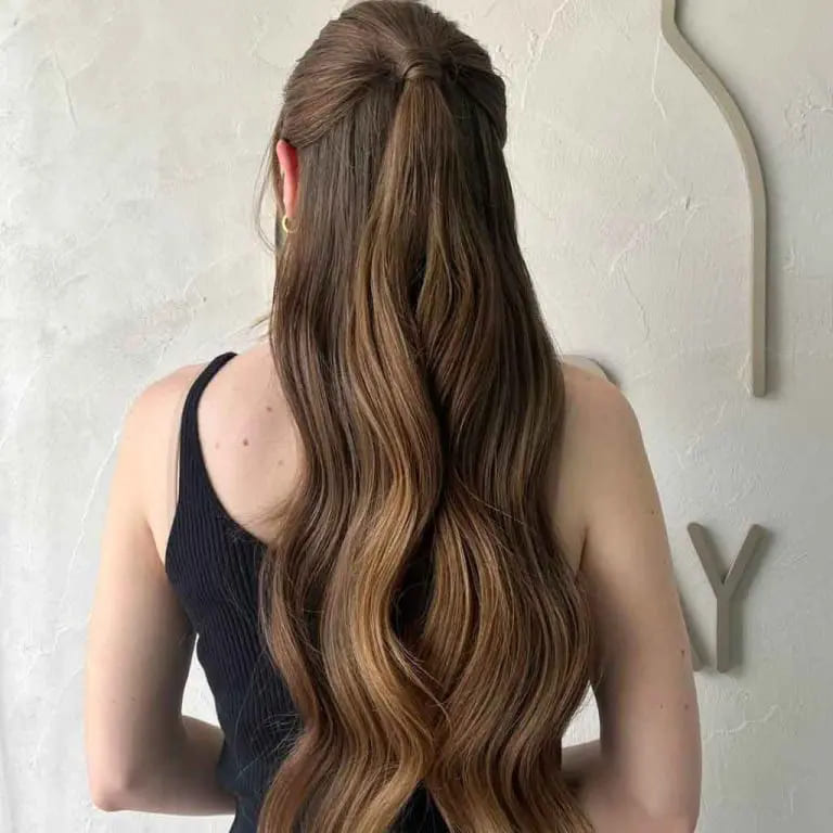 10 Elegant Hairstyles for Wavy Hair for women 8 Half-Up Half-Down Wavy Hairstyle on Long Brown Hair
