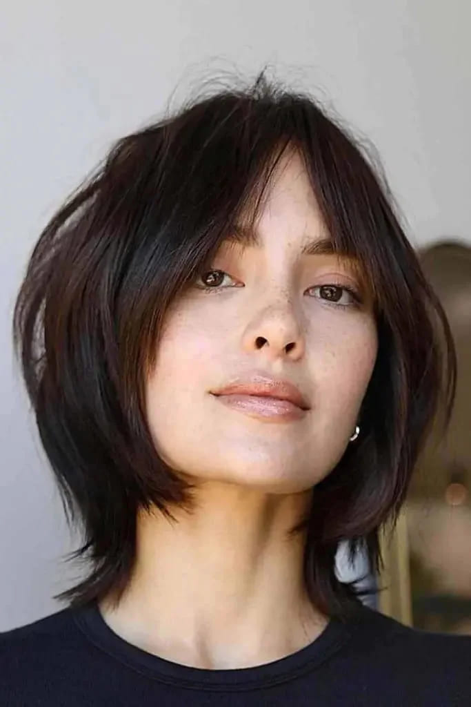 12 Best Edgy Short Haircuts For Fancy Look 7 Layered Shag With Curtain Bangs