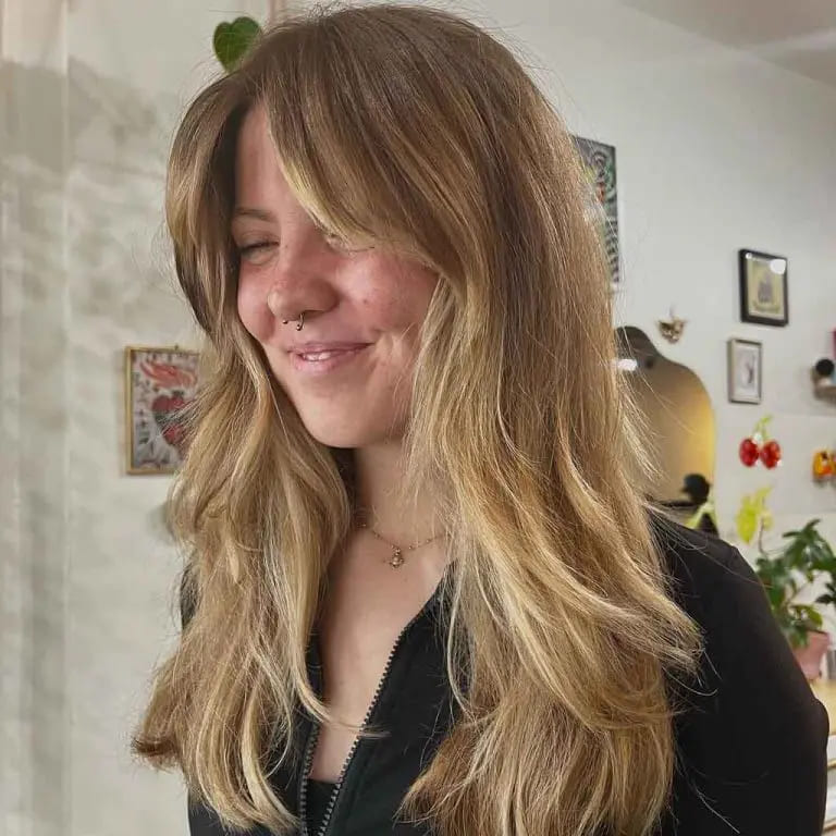 10 Stylish Haircuts for Long Haired Women 10 Layered Shaggy Blonde Haircut With Curtain Bangs