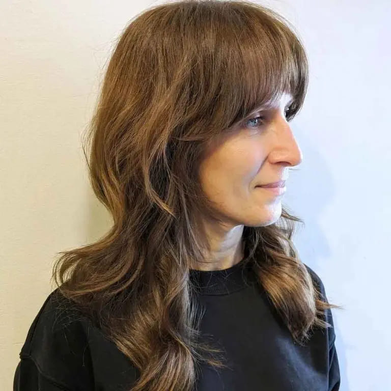 10 Brown Wolf Cut Ideas for Women to Elevate Your Style! 10 Light Brown Long Shaggy Mullet Wolf Cut With Asymmetric Blunt Bangs