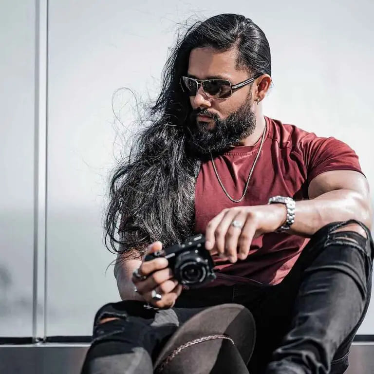 10 Haircuts for Long-Haired Men 6 Long Black Tousled Side-Swept Hair