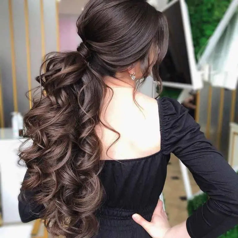 10 Chic and Classy Hairstyles for Women With Long Hair 9 Long Bouncy Dark Brown Hair With a Wavy Ponytail