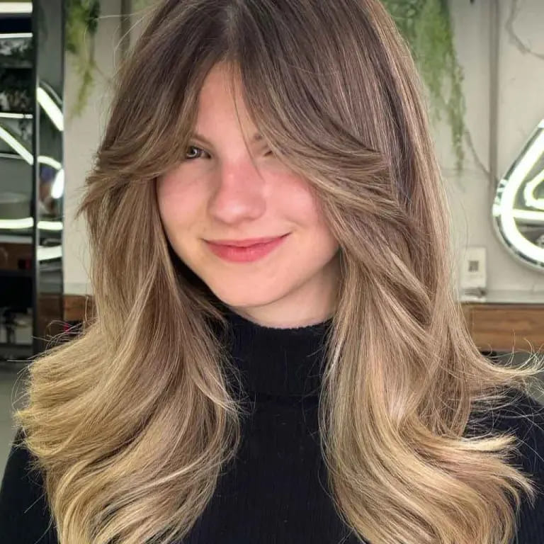 12 Butterfly Wolf Cut Ideas For Women 12 Long Bronde Fluffy Butterfly Wolf Cut With Curtain Bangs