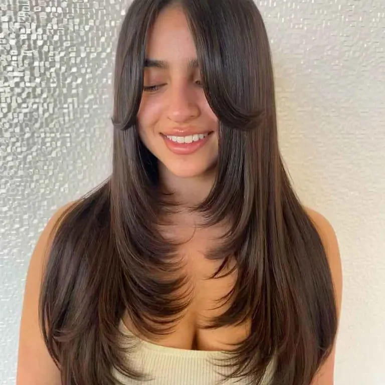 10 Stylish Haircuts for Long Haired Women 3 Long Brunette Hair With Face Framing Layers Flirty Fringe