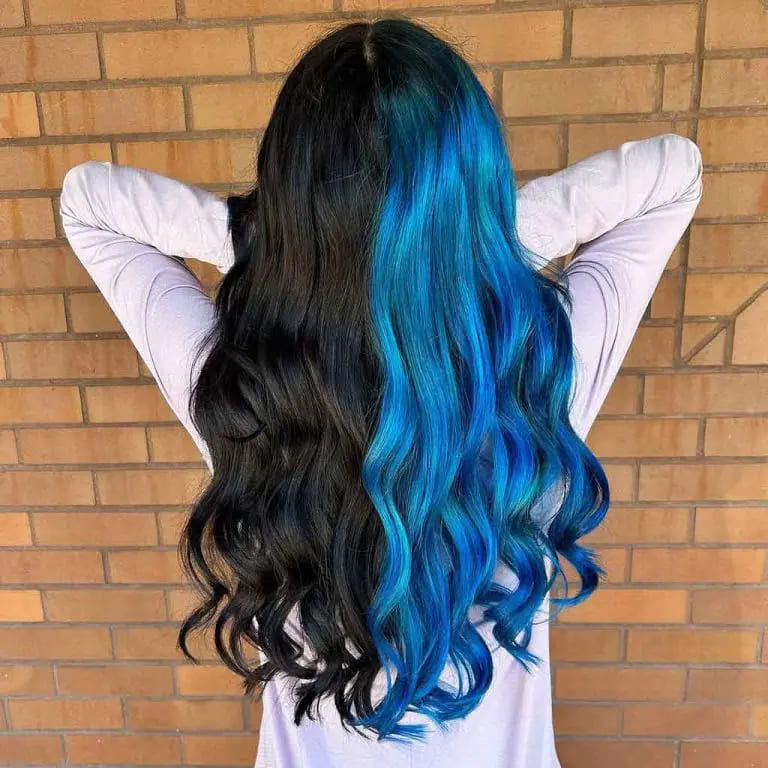 16 Gemini Hair Color Ideas to Embrace Dual-Toned Brilliance 9 Long Lustrous Black and Police Strobe Blue Wavy Gemini Hair