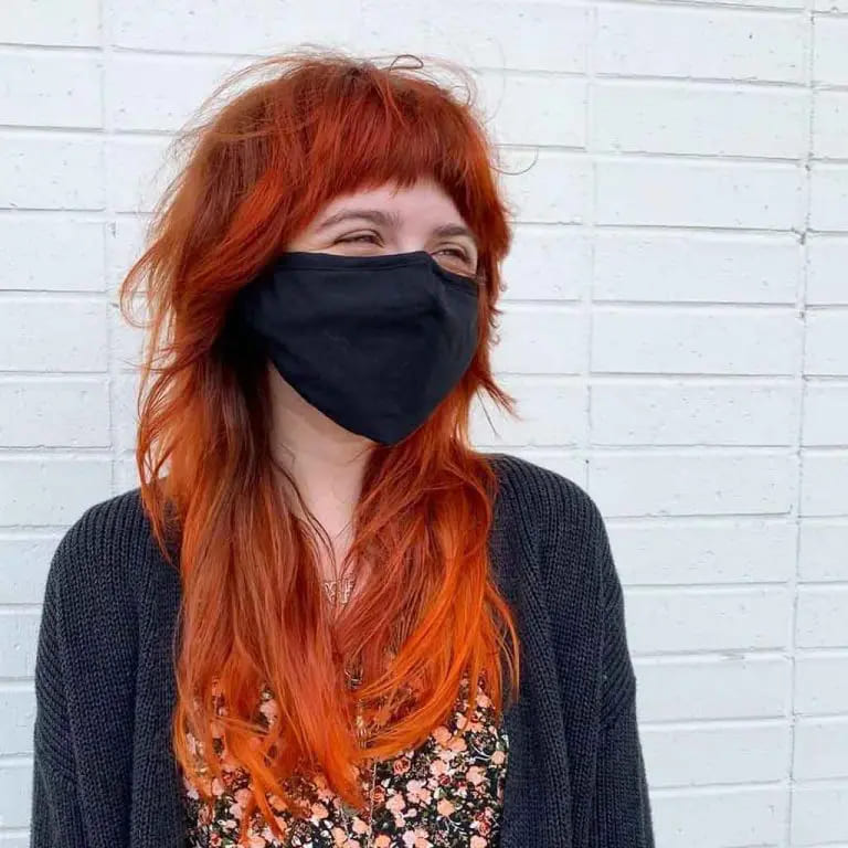 10 Spicy Ginger Wolf Cut Ideas for women 6 Long Messy Multi-Shade Ginger Wolf Cut With Short Asymmetric Bangs
