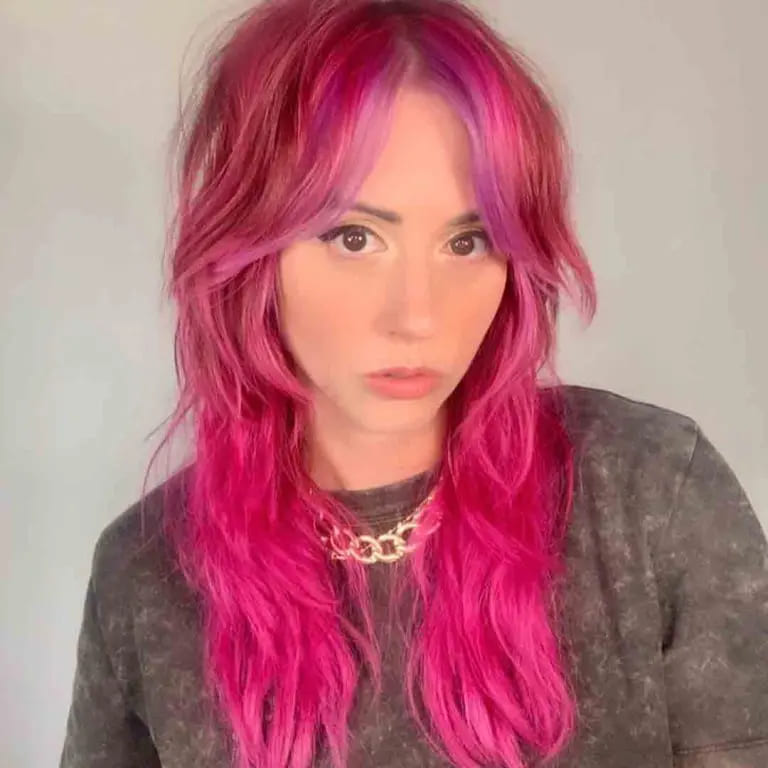 10 Best Wolf Cuts With Curtain Bangs 10 Long Shaggy Wolf Cut With Curtain Bangs on Pink Hair