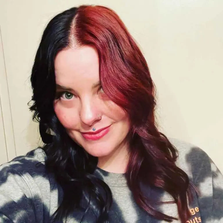16 Gemini Hair Color Ideas to Embrace Dual-Toned Brilliance 5 Long Wavy Black and Burgundy Split Gemini Hair