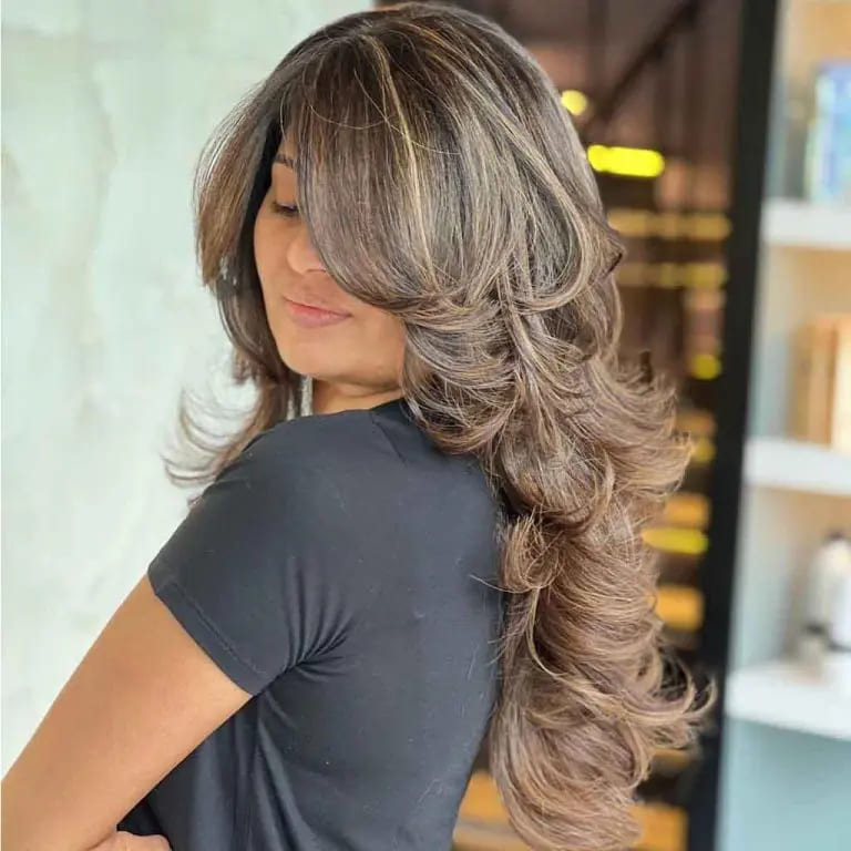 10 Stylish Haircuts for Long Haired Women 4 Long Wavy Layered Caramel Coffee Balayage