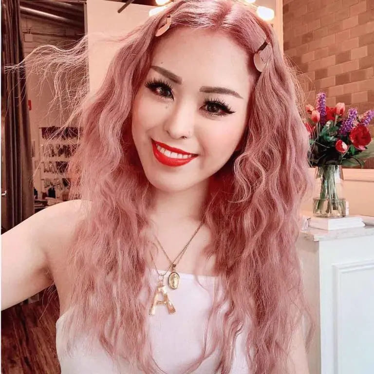 10 Elegant Hairstyles for Wavy Hair for women 6 Long Wavy Layered Pink Hair