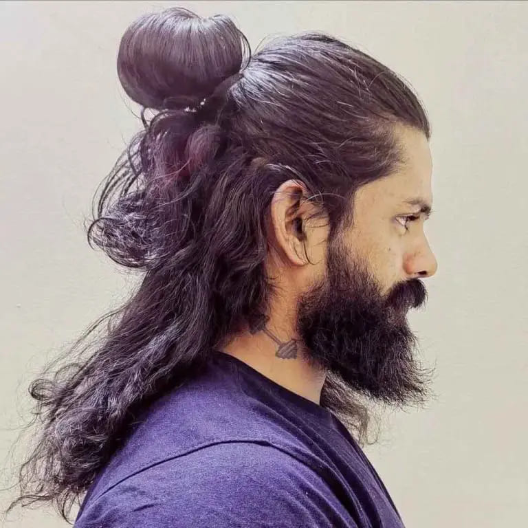 12 Dapper Hairstyles for Long-Haired Men 4 Long and Effortless Half Bun on Dark Hair