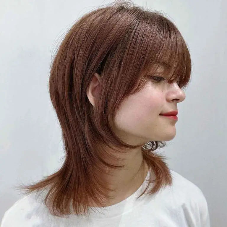 10 Brown Wolf Cut Ideas for Women to Elevate Your Style! 8 Medium Jellyfish Wolf Cut With Wispy Bangs on Chocolate Syrup Brown Hair