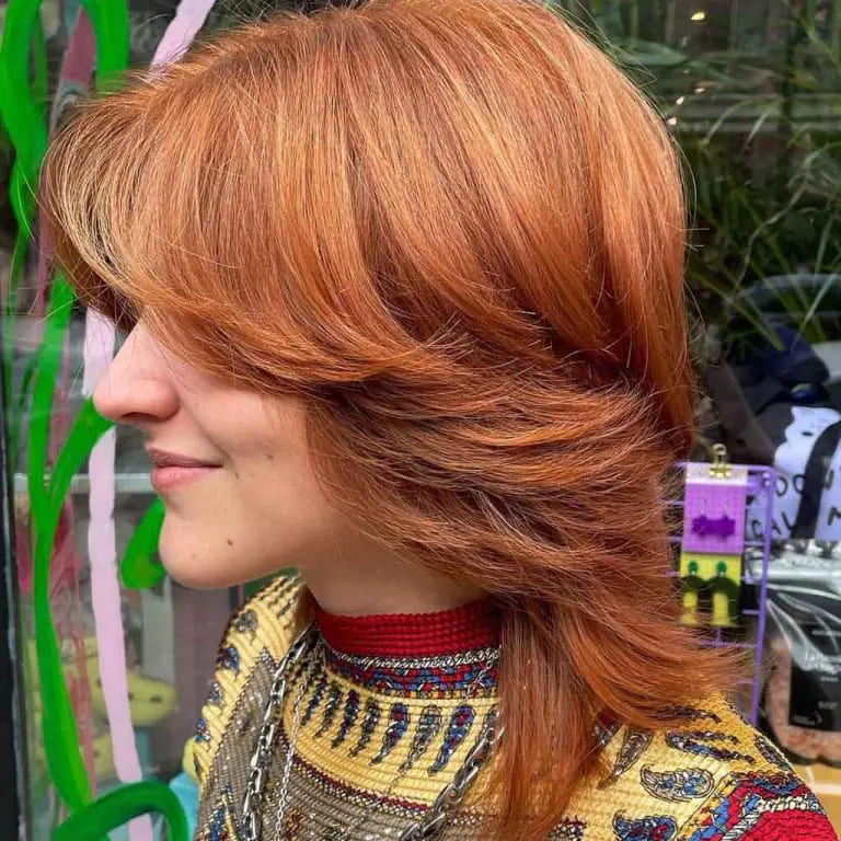 10 Spicy Ginger Wolf Cut Ideas for women 8 Medium Layered Dusty Wolf Cut With Curtain Bangs
