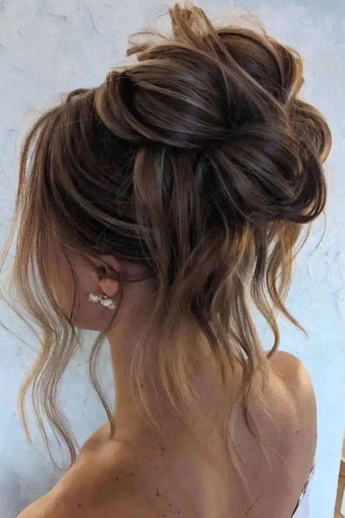 12 Stunning Hairstyles for Bridesmaids 8 Messy Brunette Updo With Blonde Highlights