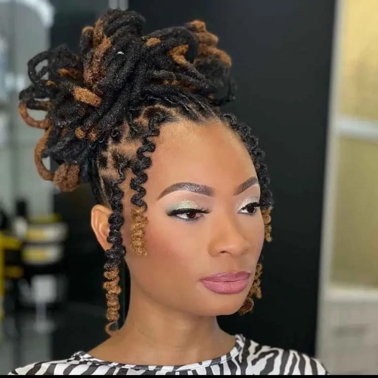 10 Stunning Hairstyles for Black Women 6 Messy Dyed Dreadlock Bun With Spiral Wavy Strands