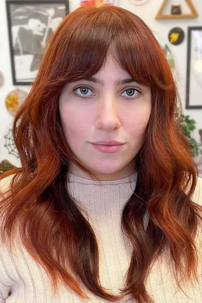 10 Fiery Chestnut Hair Color Ideas 6 Natural Chestnut Wavy Hair With Curtain Bangs