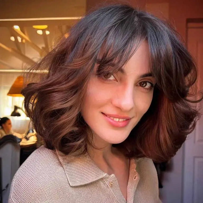 10 Beautiful Variations of Wolf Cut With Bangs For Women 10 Shaggy Wolf Cut With Face Layers and Curtain Bangs