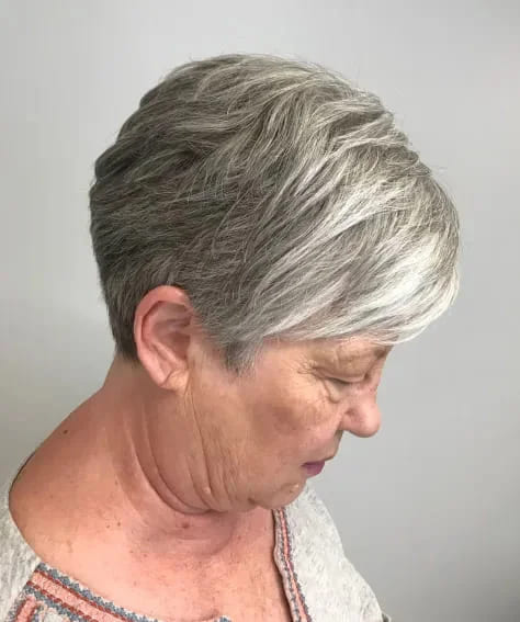 10 Best Hairstyles for Women Over 70 7 Short Salt-and-Pepper Cut with Highlighted Bangs