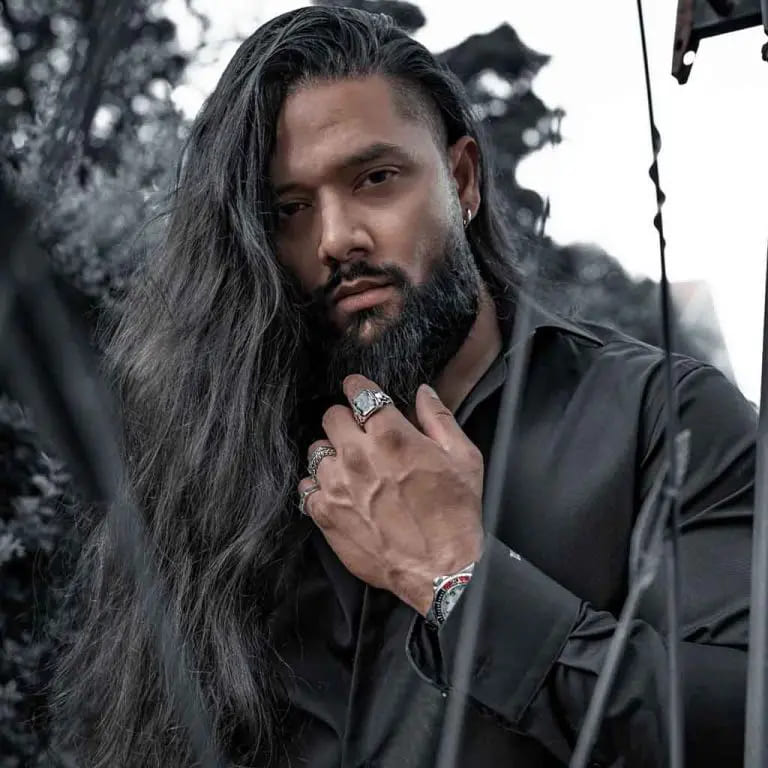 10 Haircuts for Long-Haired Men 9 Side-Swept Long Wavy Hair With Undercut