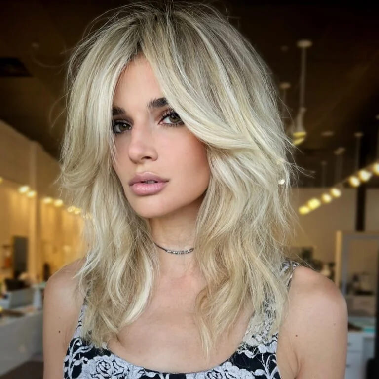 12 Shag Haircuts for Women Over 40 4 Side parting instead of bangs