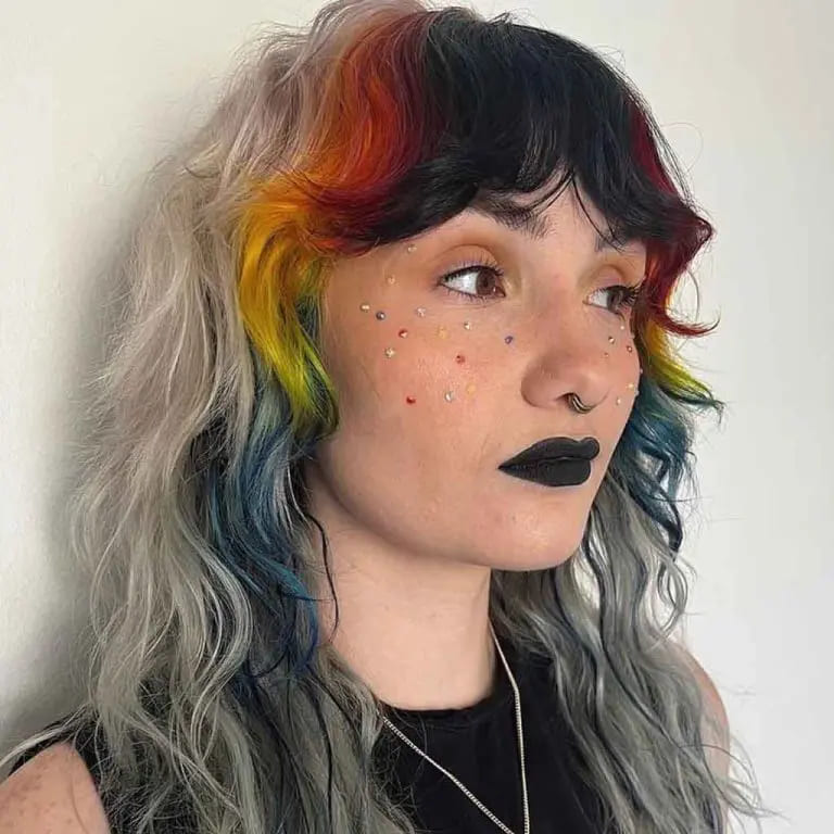 10 Wolf Cuts With Colored Bangs for Added Style 8 Soft Ash Wolf Cut With Dark Multi-Colored Wavy Curtain Bangs
