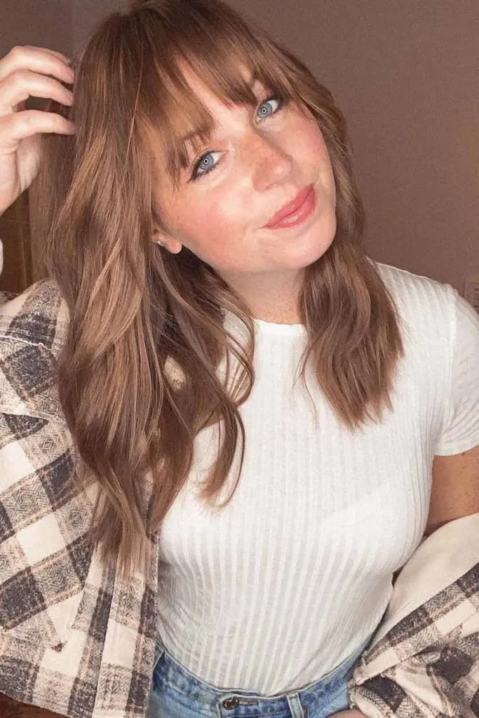 10 Fall Hair for women Trends You Must Try 4 Soft Waves with Classic Fringe