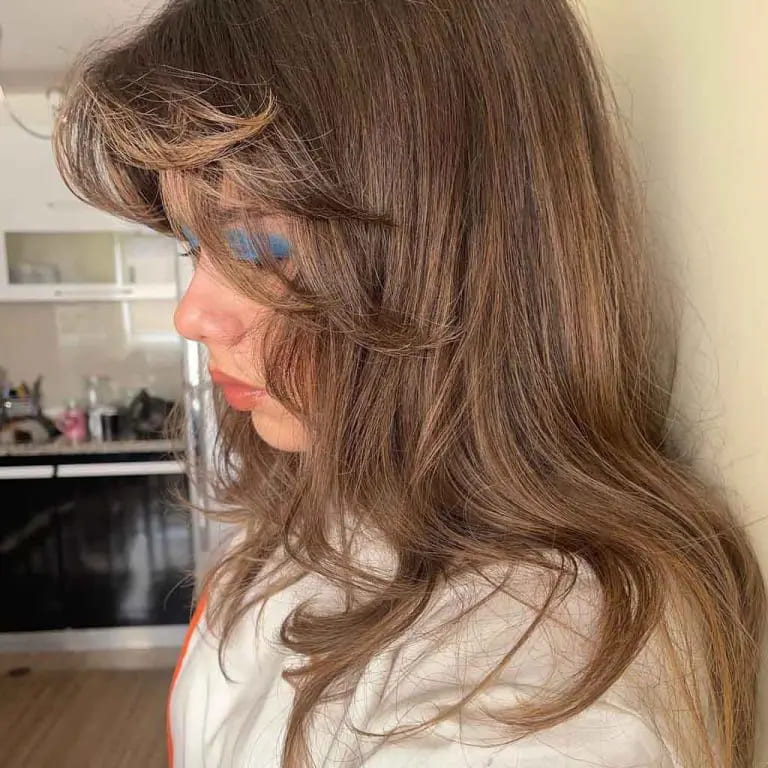 10 Brown Wolf Cut Ideas for Women to Elevate Your Style! 3 Tawny Brown Long Wolf Cut With Layered Curtain Bangs