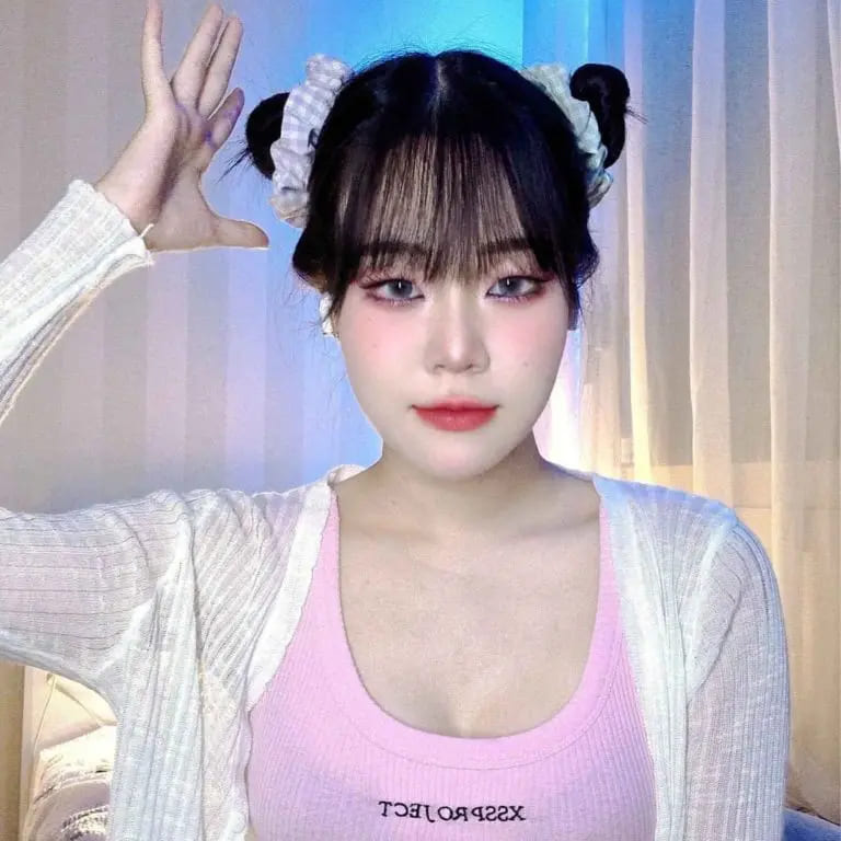 12 Stunning Korean Hairstyles for Women 4 Korean Style Space Buns With Choppy Bangs