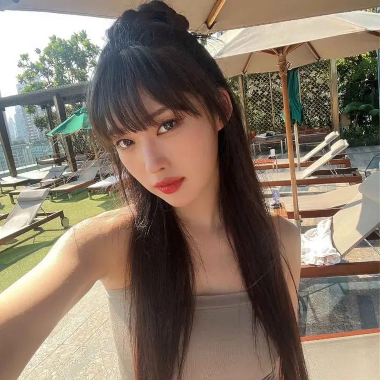 12 Stunning Korean Hairstyles for Women 9 Long Straight Korean Hairstyle With Blunt Bangs and Bun