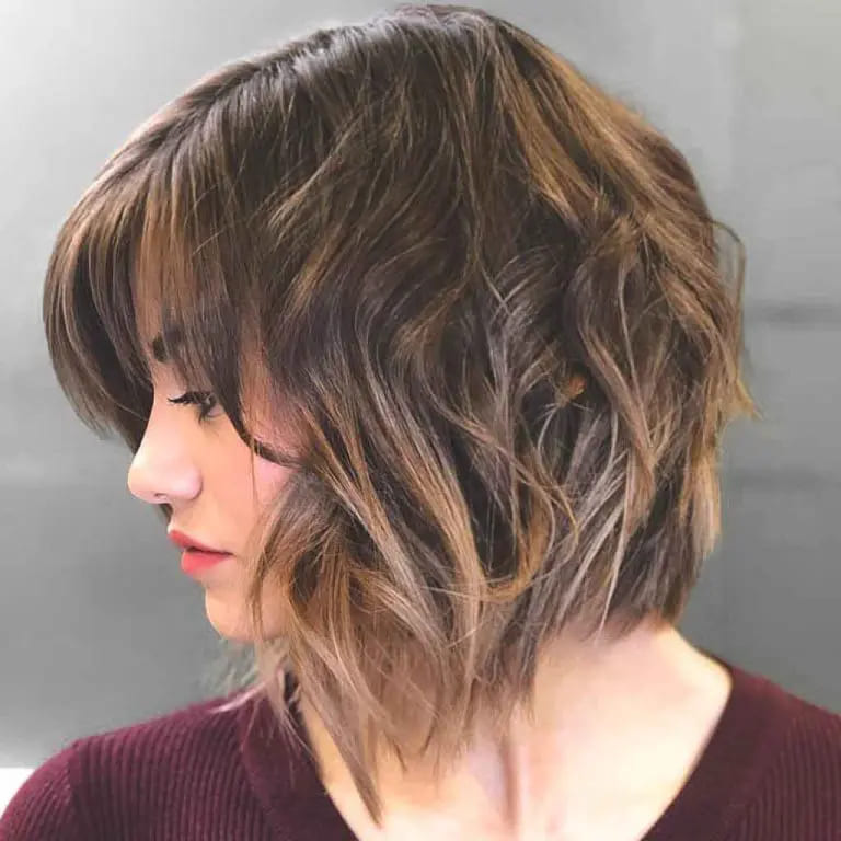 11 Best Hairstyles With Caramel Highlights 7 Tousled Bob Cut With Caramel Highlights and Bangs