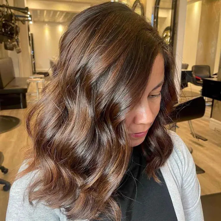 11 Best Hairstyles With Caramel Highlights 9 Wavy Brunette Hair With Warm Caramel Streaks