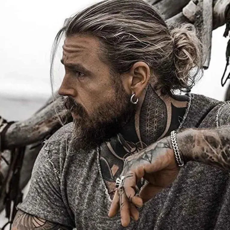 12 Dapper Hairstyles for Long-Haired Men 2 Viking Style Dark Man Bun With Blonde Highlights