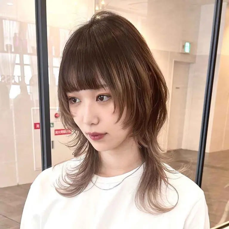 10 Brown Wolf Cut Ideas for Women to Elevate Your Style! 7 Walnut Brown Jellyfish Wolf Cut With Choppy Bangs on Medium-Length Hair