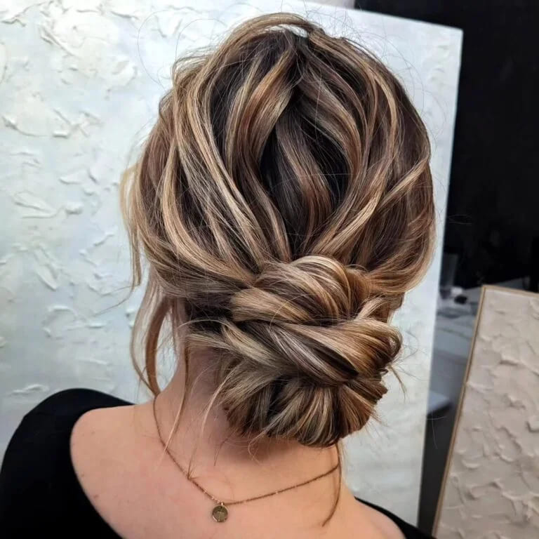 12 Stunning Hairstyles for Bridesmaids 7 Wavy Messy Twisted Low Bun