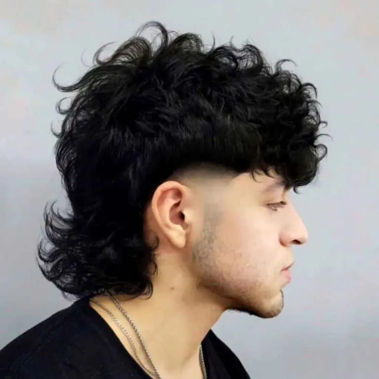 10 Stylish Wolf Cut Ideas For Men 3 Wavy Mullet Wolf Cut With a Taper Fade