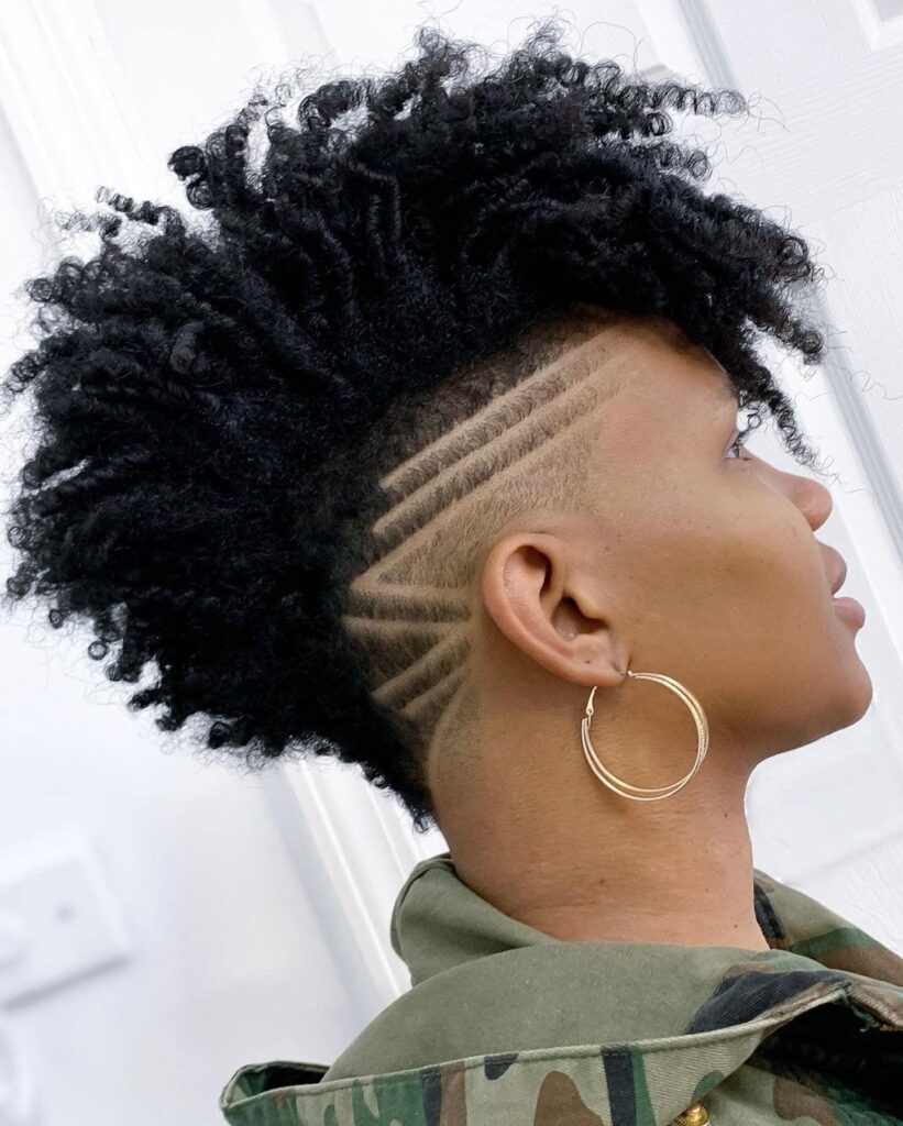 17 One Side Shaved Hairstyles for Black Women That Scream Confidence and Style 1 curly mohawk with shaved side patterns