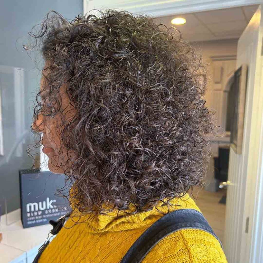 20 Classy Short Wolf Cut Ideas to Turn Heads! 6 Curly Fluffy Medium Wolf Cut