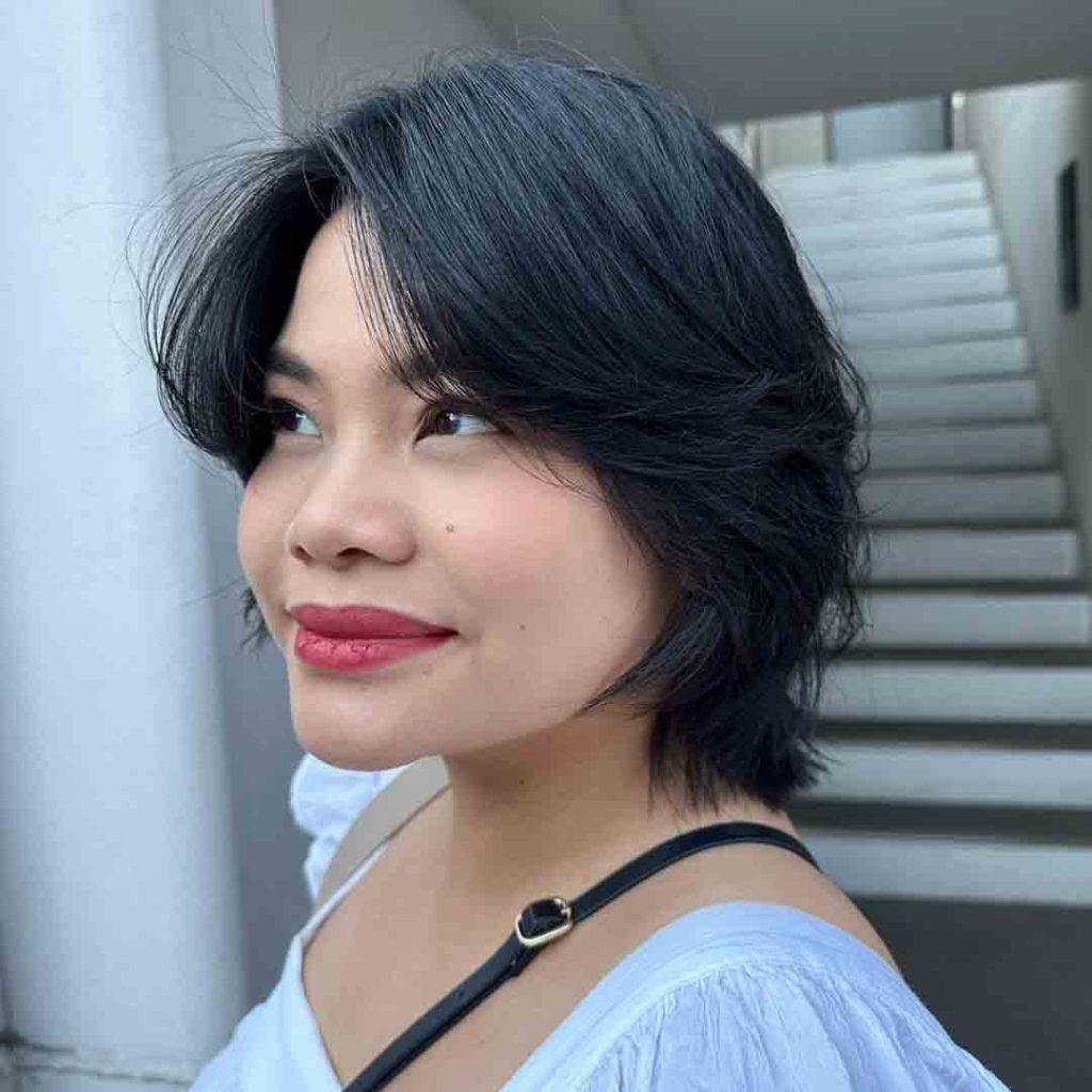 20 Classy Short Wolf Cut Ideas to Turn Heads! 8 Wolf Cut on Short Voluminous Black Hair