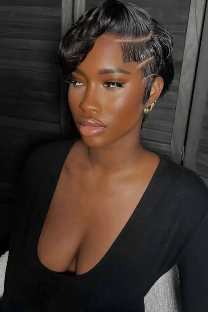 10 Chic Pixie Cuts For Black Women 1 1. Black Pixie Cut With Undercut and Side Swept Bangs