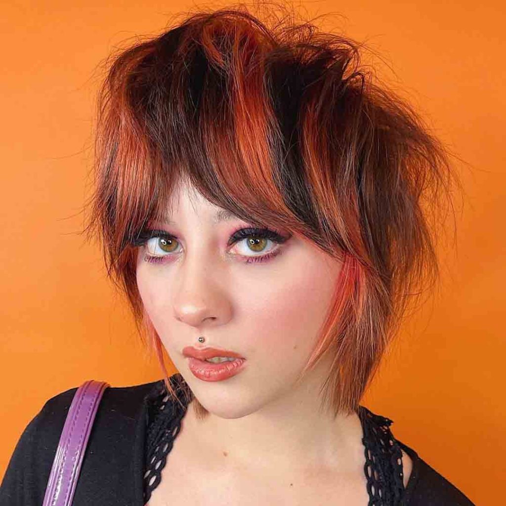 20 Classy Short Wolf Cut Ideas to Turn Heads! 13 Razor Wolf Cut on Duo-Toned Hair With Curtain Bangs