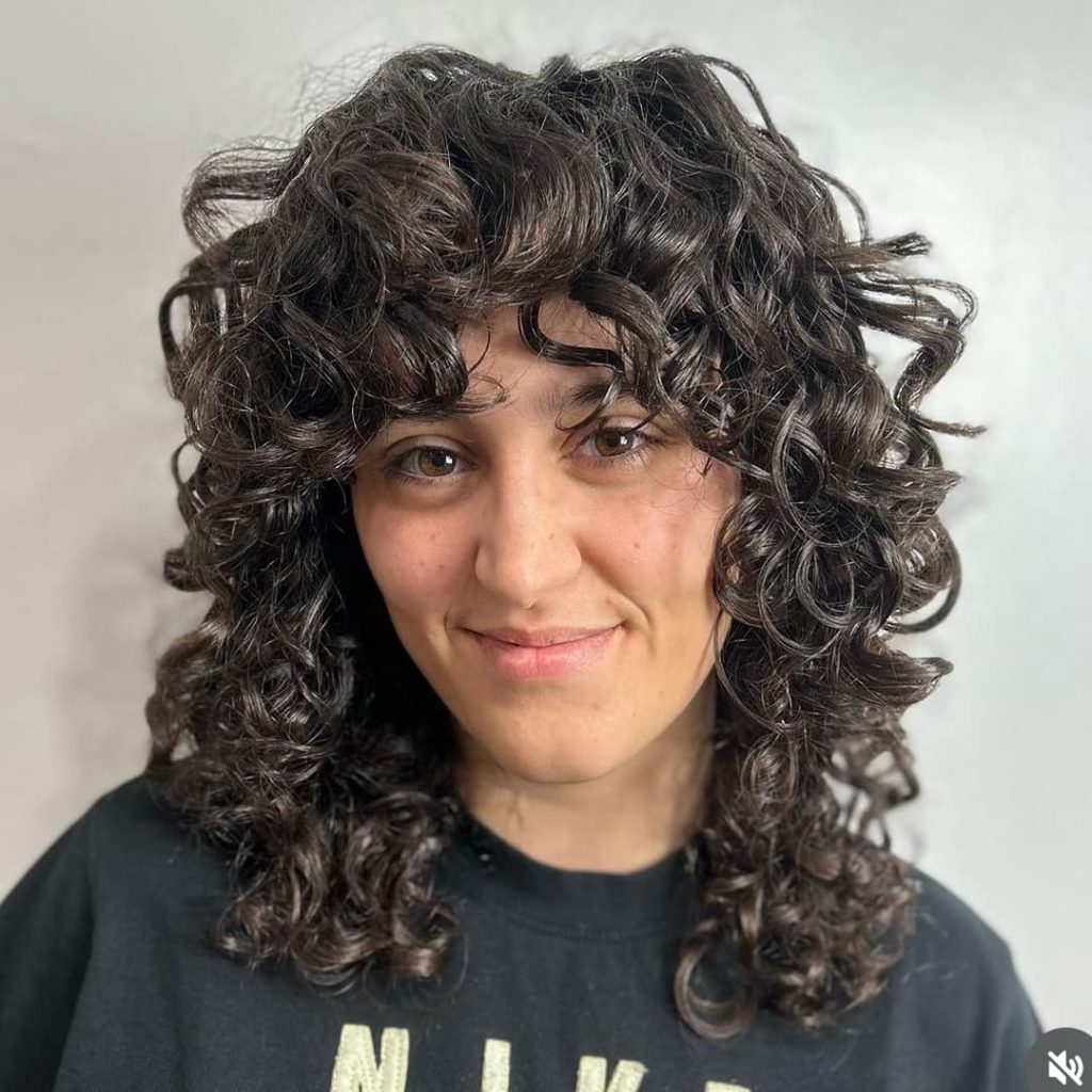 30 Best Curly Wolf Cut Ideas to Showcase Your Beautiful Curls 13 Curly Wolf Cut Done with the DevaCut Technique