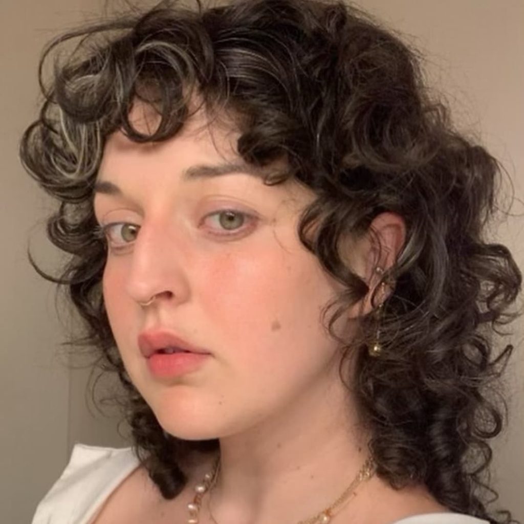 30 Best Curly Wolf Cut Ideas to Showcase Your Beautiful Curls 15 Casual Wolf Cut on Curly Short Hair